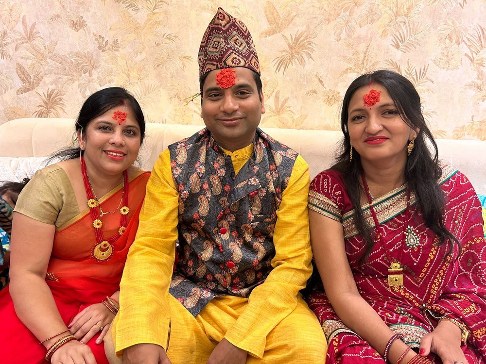Nepali Tika — traditional dhaka topi and blessings